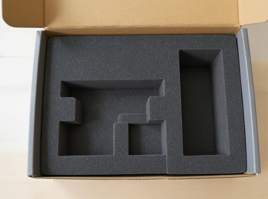 Cross-section view of custom insert showing precise product cutouts and protective padding