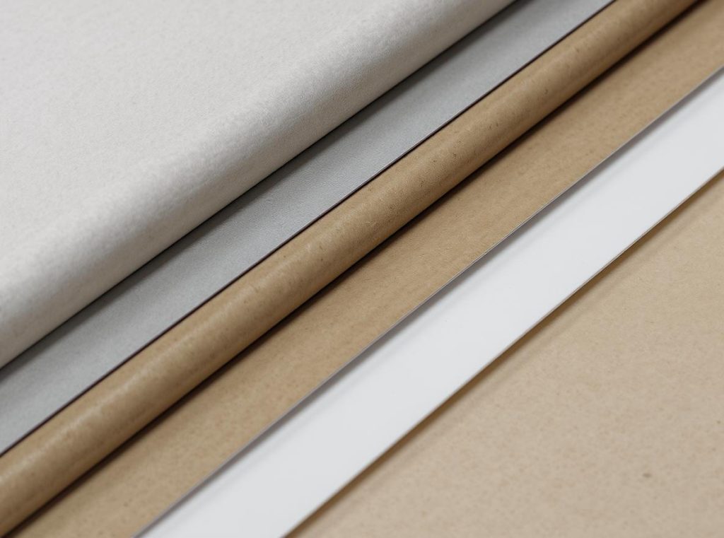 Premium paper stocks and cardboard materials used for high-end rigid box construction